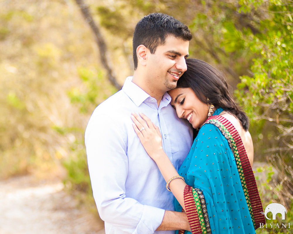 Portrait of an Indian wedding couple posing in front of camera for photo  album Stock Photo - Alamy