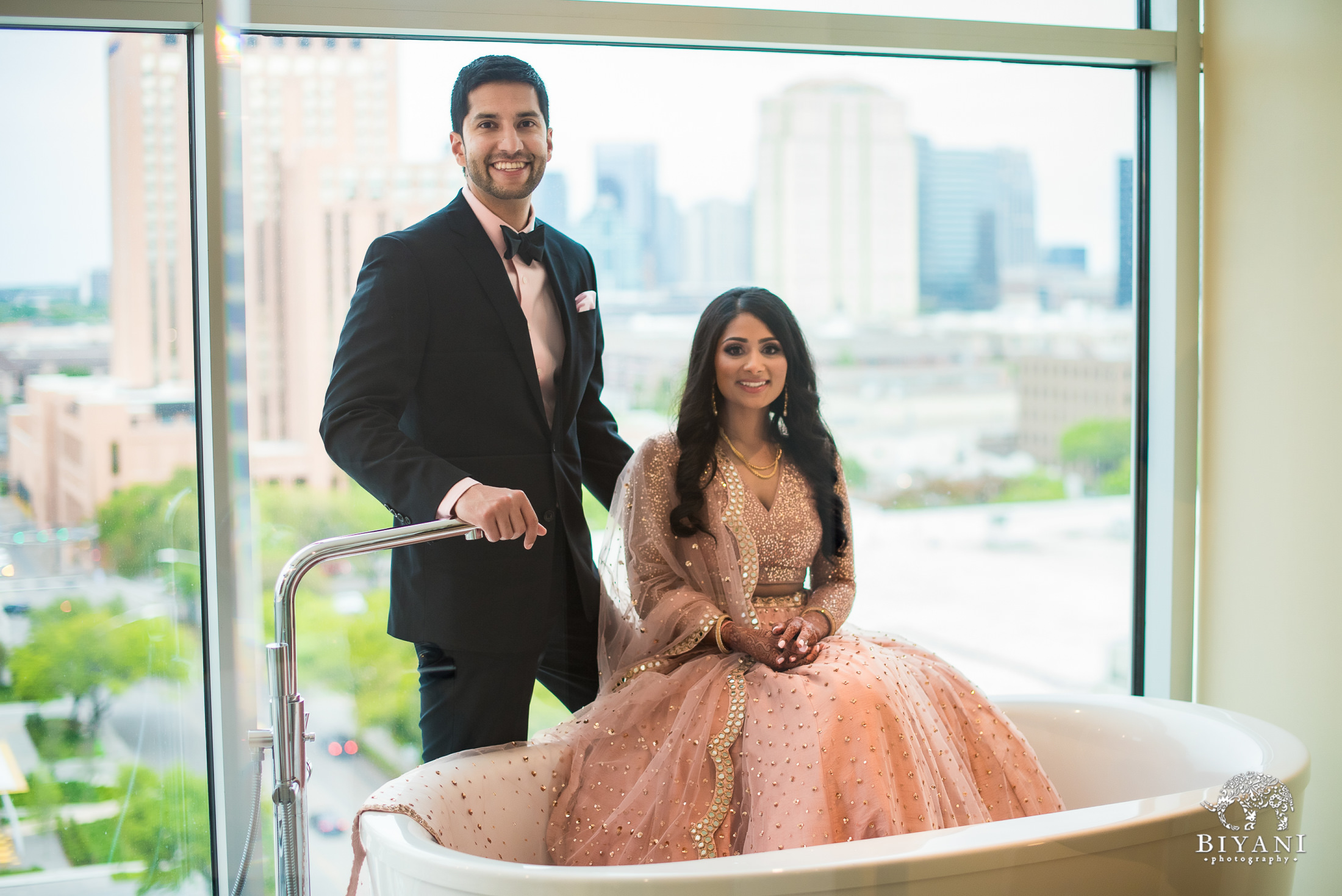 Indian couple posing at their reception stage. | Photo 98602